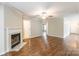 Open living room with a fireplace and hardwood floors at 5832 Amity Springs Dr, Charlotte, NC 28212