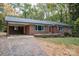 Brick ranch home with attached garage and American flag at 1207 S Poplar St, Landis, NC 28088