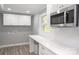 Laundry room with white cabinets and quartz countertop at 1207 S Poplar St, Landis, NC 28088