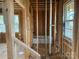 Interior framing of a bathroom with plumbing and electrical, showing the initial stages of construction at 1506 7Th St, Statesville, NC 28677