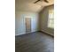 Bedroom with hardwood floors and ceiling fan at 1506 7Th St, Statesville, NC 28677