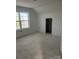 Unfinished bedroom showing the bright, naturally lit room with visible framing at 1506 7Th St, Statesville, NC 28677