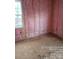 Unfinished bedroom with pink insulation and natural light at 1506 7Th St, Statesville, NC 28677