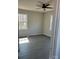 Bedroom with a ceiling fan, natural light from two windows, and a neutral color palette at 1506 7Th St, Statesville, NC 28677