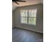 Bedroom with hardwood floors and ceiling fan at 1506 7Th St, Statesville, NC 28677