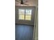 Bedroom featuring wood-look floors, a ceiling fan, and natural light coming in from a large window at 1506 7Th St, Statesville, NC 28677