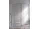 A white closet with bi-fold doors with raised paneling at 1506 7Th St, Statesville, NC 28677