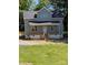 Charming home featuring a covered porch and a classic gray color scheme at 1506 7Th St, Statesville, NC 28677