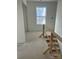 Unfinished hallway featuring staircase, natural light and the structural framework for completion and customization at 1506 7Th St, Statesville, NC 28677