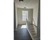 Hallway with wood-look floors, light walls and a view of the staircase leading to the floor below at 1506 7Th St, Statesville, NC 28677