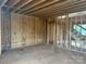 Interior view of unfinished room with stairs and exposed wood framing at 1506 7Th St, Statesville, NC 28677