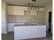 Bright kitchen with white cabinets, granite countertops, and a central island at 1506 7Th St, Statesville, NC 28677