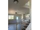 Living room with stairs and hardwood floors and ceiling fan at 1506 7Th St, Statesville, NC 28677
