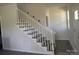 Elegant staircase featuring white railings and light wood steps at 1506 7Th St, Statesville, NC 28677