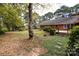 Backyard of home features deck and large trees at 5444 Marengo Cir, Charlotte, NC 28216
