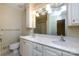 Bathroom with double sinks, a large mirror, and ample lighting creates a luxurious feel at 5444 Marengo Cir, Charlotte, NC 28216