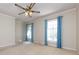 Inviting bedroom with a ceiling fan and large windows that offer natural light at 5444 Marengo Cir, Charlotte, NC 28216