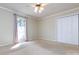 Neutral bedroom with window, white trim, and closet at 5444 Marengo Cir, Charlotte, NC 28216