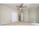 Neutral bedroom features carpet, white trim, and a ceiling fan at 5444 Marengo Cir, Charlotte, NC 28216