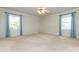 Spacious bedroom with natural light, a ceiling fan, and neutral décor creates a relaxing atmosphere at 5444 Marengo Cir, Charlotte, NC 28216