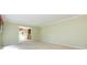 Well-lit room with carpet, neutral walls, a built-in cabinet, and a view of the home's exterior at 5444 Marengo Cir, Charlotte, NC 28216