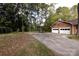 View of brick garage, driveway, and basketball goal at 5444 Marengo Cir, Charlotte, NC 28216