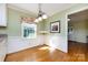 Cozy breakfast nook with wainscoting and a charming window with floral valance at 5444 Marengo Cir, Charlotte, NC 28216