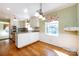 Charming kitchen with hardwood floors, granite counters, and breakfast area at 5444 Marengo Cir, Charlotte, NC 28216