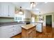 Spacious kitchen featuring an island, stainless steel appliances, and white cabinetry at 5444 Marengo Cir, Charlotte, NC 28216