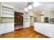 Bright kitchen featuring white cabinets, a central island, and hardwood floors, offering ample storage and counter space at 5444 Marengo Cir, Charlotte, NC 28216