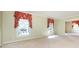 Spacious living room with carpet, large windows, crown molding, and access to other areas at 5444 Marengo Cir, Charlotte, NC 28216