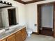 Bathroom with a marble countertop vanity, toilet, and walk-in closet at 909 Woodhurst Dr, Monroe, NC 28110