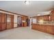 Spacious kitchen featuring wood cabinets, tile floors, and modern stainless-steel appliances at 909 Woodhurst Dr, Monroe, NC 28110