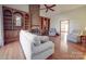 The living room features a brick fireplace, hardwood floors, and built-in bookshelves at 909 Woodhurst Dr, Monroe, NC 28110