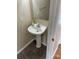 Bathroom featuring dark flooring, a pedestal sink, and neutral paint at 1067 19Th Ne St # B, Hickory, NC 28601