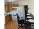 Close up view of the kitchen with white appliances and oak cabinets at 1067 19Th Ne St # B, Hickory, NC 28601