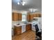 Bright kitchen featuring oak cabinets, white countertops, and modern appliances at 1067 19Th Ne St # B, Hickory, NC 28601