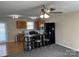 View of the open kitchen and bar seating with natural light and wooden cabinetry at 1067 19Th Ne St # B, Hickory, NC 28601