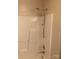 Clean white shower with chrome fixtures and shelving at 1067 19Th Ne St # B, Hickory, NC 28601