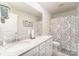 Double vanity bathroom with a shower/tub combo and patterned curtain at 126 Walleye Ln, Troutman, NC 28166