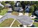 Aerial view showcasing a home on a cul-de-sac with surrounding greenery and neighborhood streets at 14301 Beryl Ct, Pineville, NC 28134