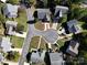 Aerial view of a home on a cul-de-sac street with green lawns and mature trees at 14301 Beryl Ct, Pineville, NC 28134