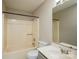 A clean bathroom featuring a tub with a shower, toilet, and a well-lit sink with vanity mirror at 14301 Beryl Ct, Pineville, NC 28134