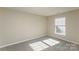 This bright bedroom has carpet flooring and a window that lets in natural light at 14301 Beryl Ct, Pineville, NC 28134
