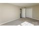 Bedroom featuring carpet flooring and a closet at 14301 Beryl Ct, Pineville, NC 28134
