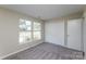 This bedroom has carpet flooring, a double window, and a closet at 14301 Beryl Ct, Pineville, NC 28134