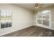 Dining room features hardwood floors, large windows, and a sliding glass door with great natural light at 14301 Beryl Ct, Pineville, NC 28134