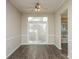 Dining area features hardwood floors, neutral colors, and sliding glass doors for access to outdoor space at 14301 Beryl Ct, Pineville, NC 28134