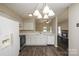 Spacious kitchen with modern appliances, countertops, and seamless flow into the living space at 14301 Beryl Ct, Pineville, NC 28134