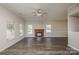Spacious living room offers a fireplace, hardwood floors, natural light, and an open layout at 14301 Beryl Ct, Pineville, NC 28134